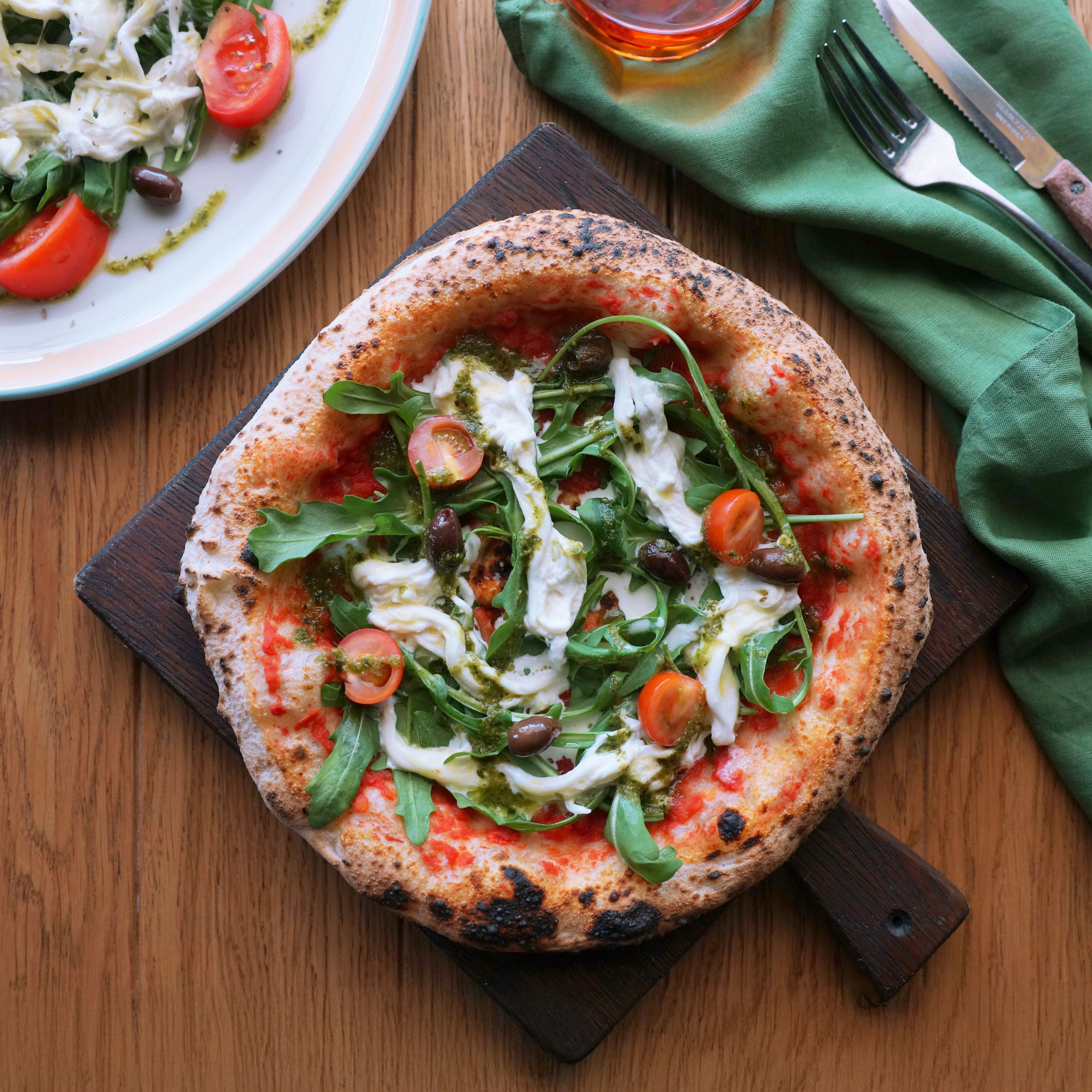 Neapolitan pizza with stracciatella cheese.